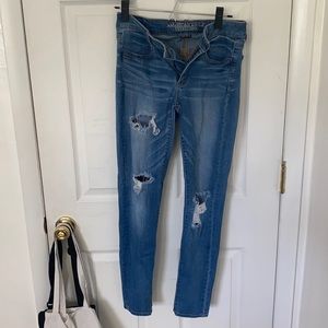Medium wash distressed denim jeans